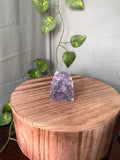 54g natural Amethyst cluster featuring sparkling lavender-purple Quartz crystal points on a freestanding formation.