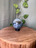 252g natural Moss Agate crystal sphere featuring green moss-like inclusions and a sparkling druzy quartz pocket