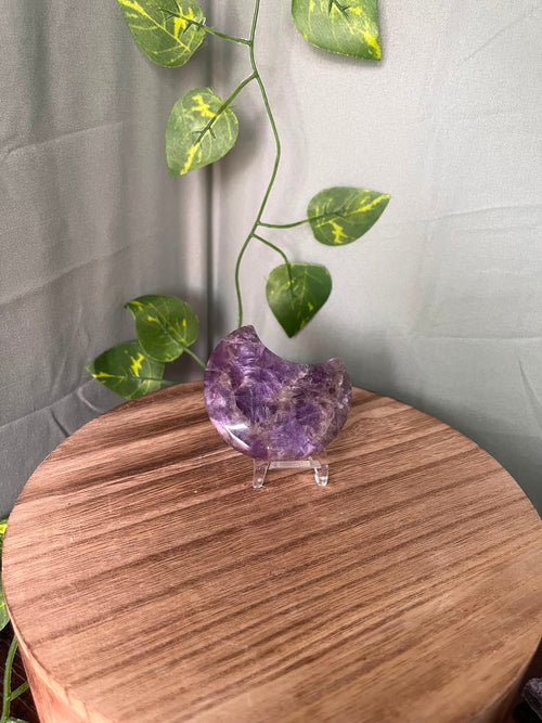 58g polished Amethyst crescent moon carving displaying rich purple colour with natural chevron Quartz patterning.