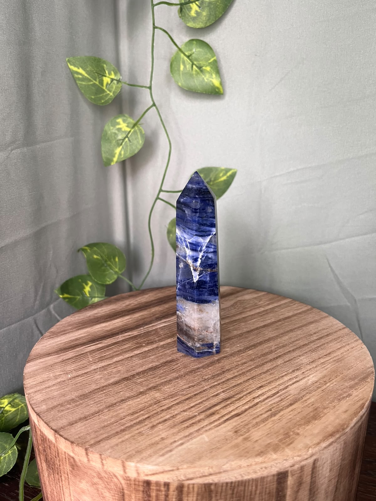 104g polished Sodalite point featuring rich royal blue colouring with striking natural white Calcite veining.