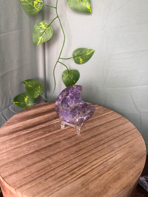 58g polished Amethyst crescent moon carving displaying rich purple colour with natural chevron Quartz patterning.