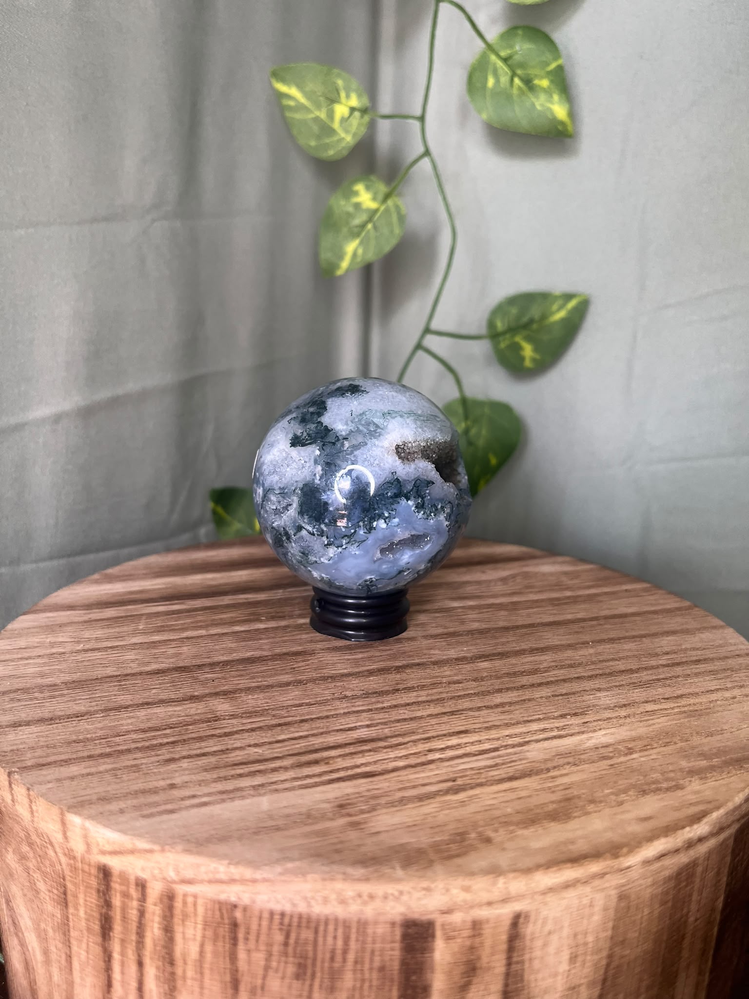 252g natural Moss Agate crystal sphere featuring green moss-like inclusions and a sparkling druzy quartz pocket