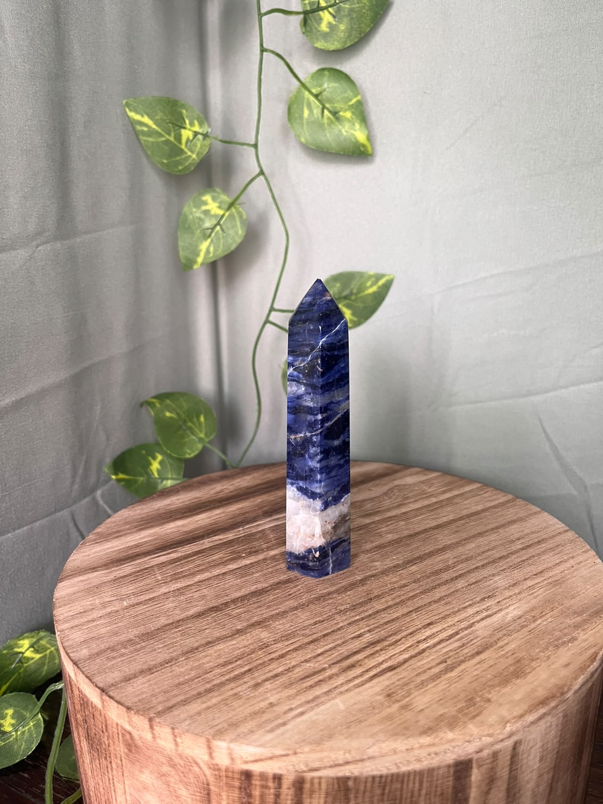 104g polished Sodalite point featuring rich royal blue colouring with striking natural white Calcite veining.