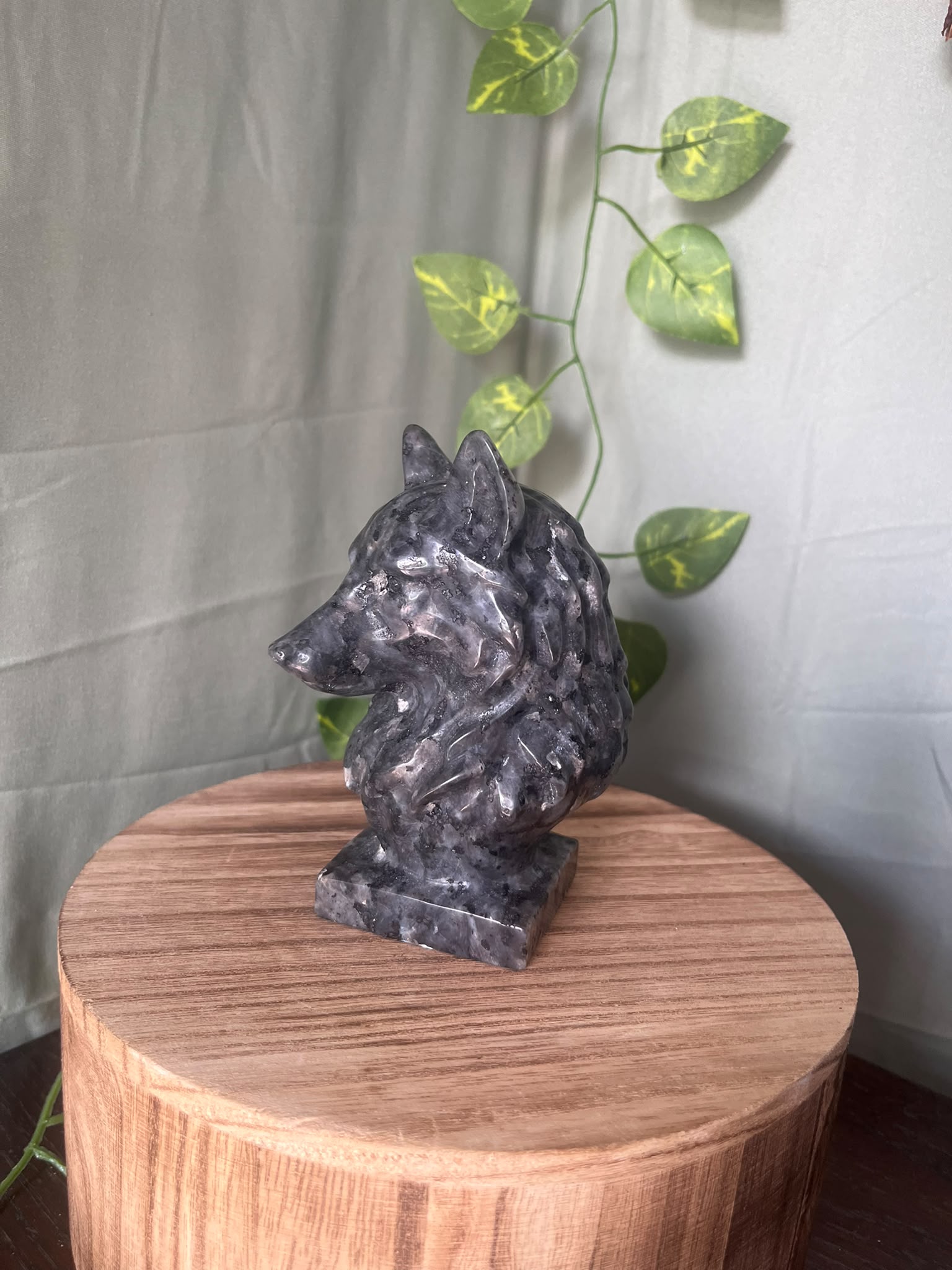 735g natural Larvikite wolf crystal carving featuring shimmering silver feldspar flashes and detailed wolf craftsmanship.