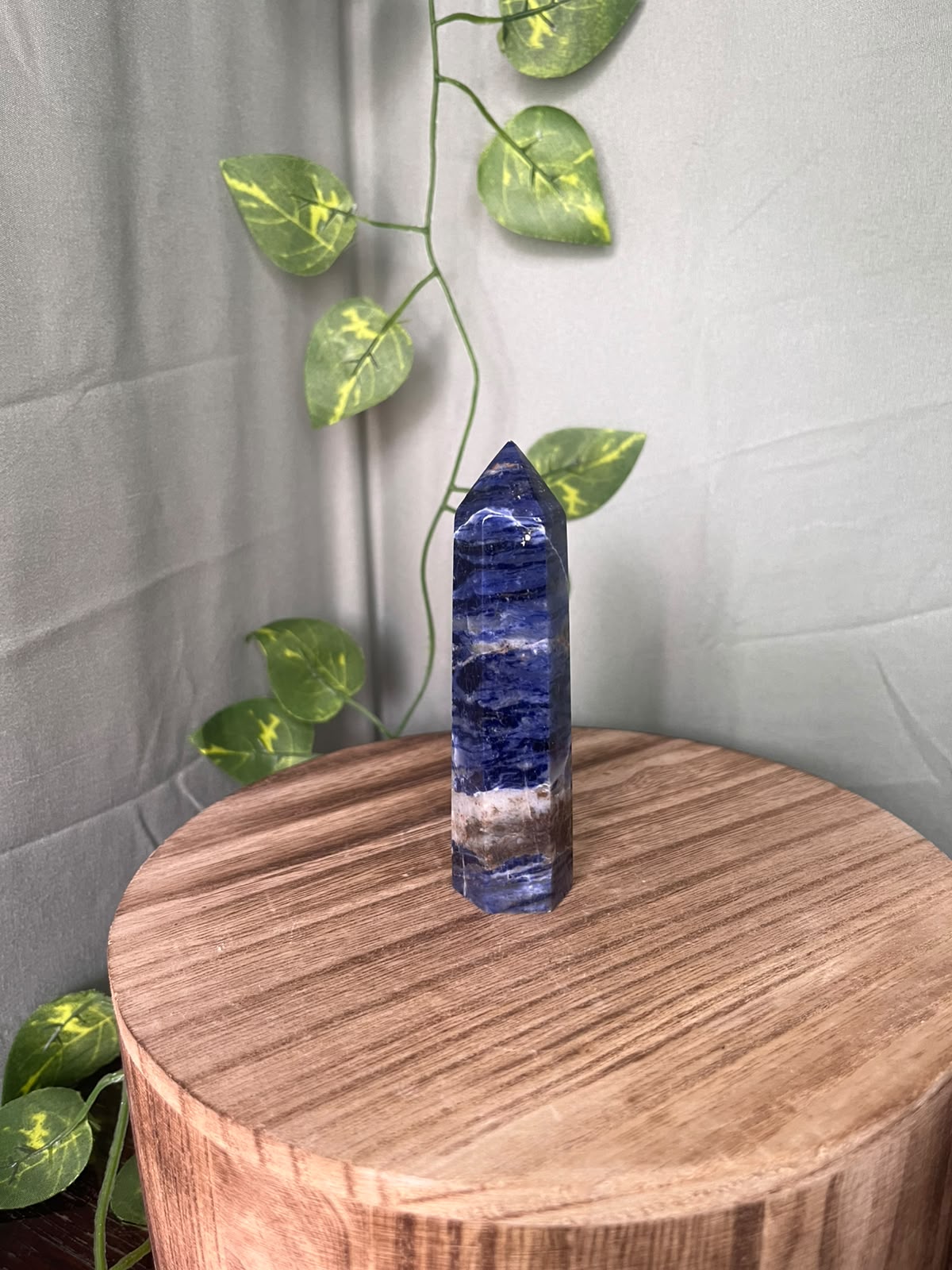 104g polished Sodalite point featuring rich royal blue colouring with striking natural white Calcite veining.